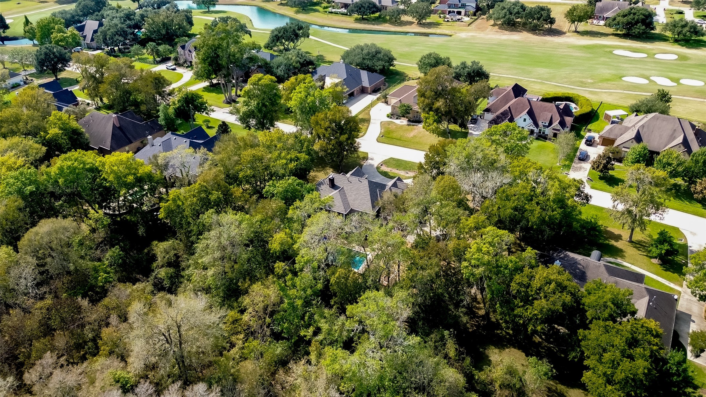 32819 Whitburn Trail Fulshear, TX 77441 - Photo 42 of 49 a view of a lake with houses