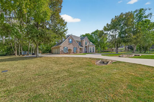 a house view with swimming pool in front of it