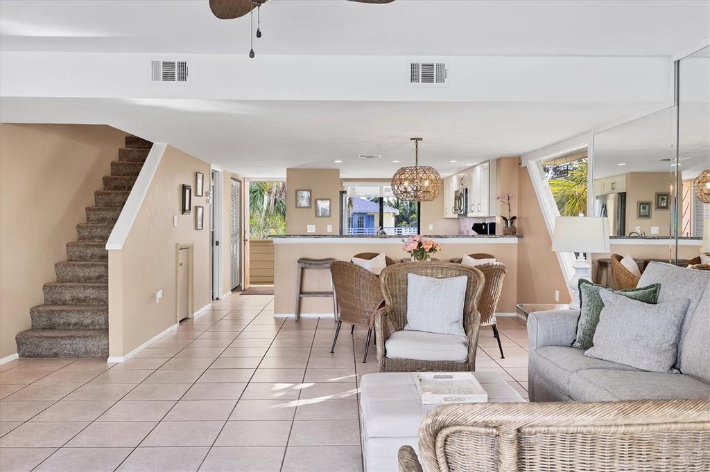 540 Beach Road, Unit 510 Sarasota, FL 34242 - Photo 16 of 96 a living room with furniture and a dining table with kitchen view