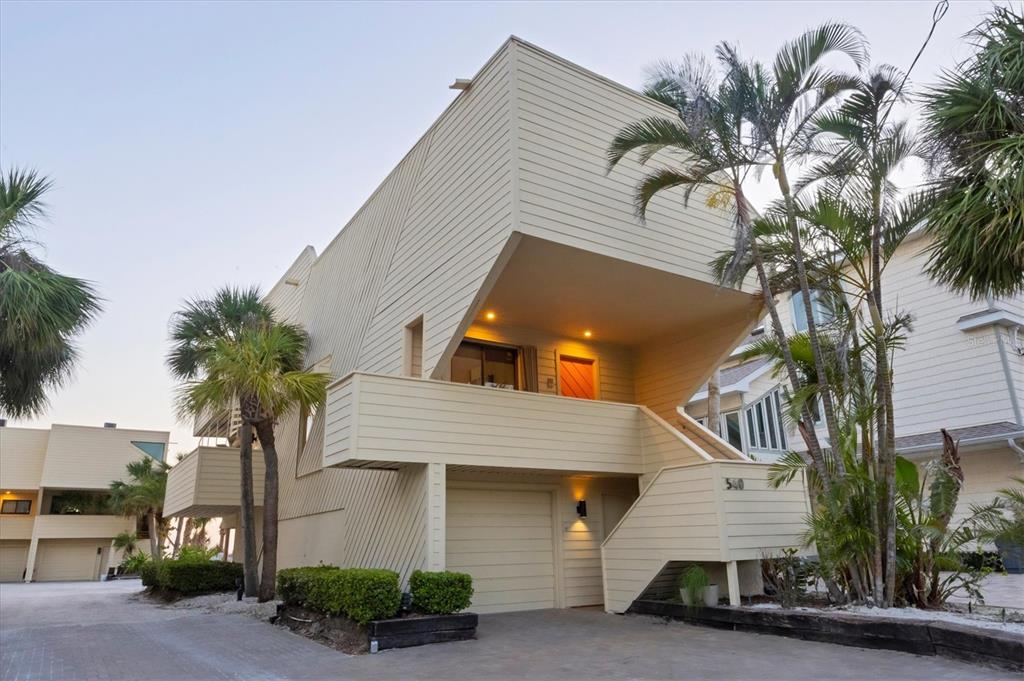 540 Beach Road, Unit 510 Sarasota, FL 34242 - Photo 2 of 96 a front view of a house with a garage