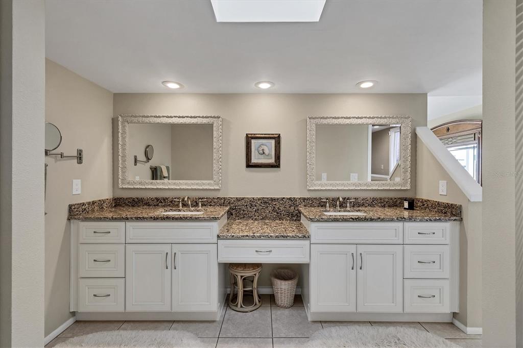 540 Beach Road, Unit 510 Sarasota, FL 34242 - Photo 42 of 96 a bathroom with a granite countertop sink two mirror and a