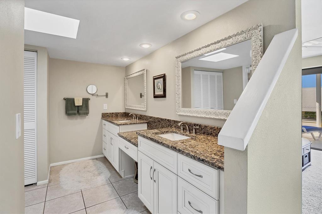 540 Beach Road, Unit 510 Sarasota, FL 34242 - Photo 44 of 96 a spacious bathroom with a sink and a mirror