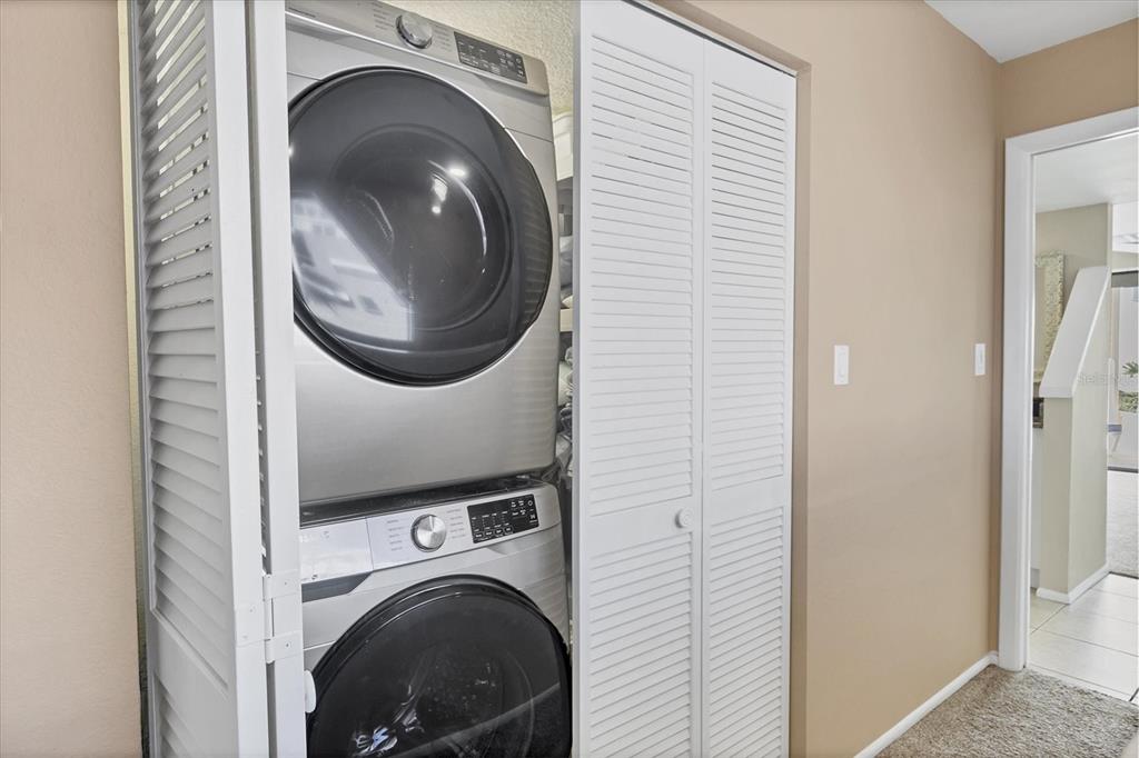 540 Beach Road, Unit 510 Sarasota, FL 34242 - Photo 46 of 96 a view of a hallway with washer and dryer