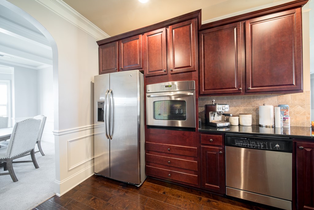 33 Utah Street Fort Mitchell, AL 36856 - Photo 14 of 49 a kitchen with stainless steel appliances granite countertop a refrigerator and a stove top oven