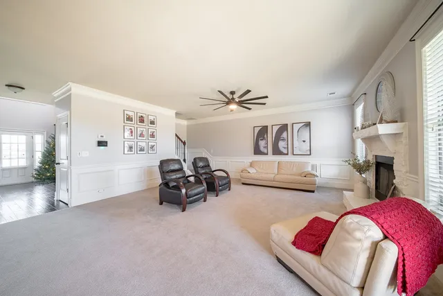 a bedroom with furniture and a fireplace