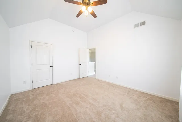 a bedroom with bed and window