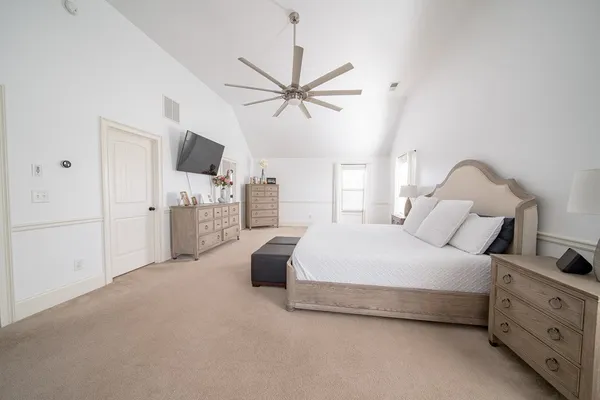 a bedroom with bed and tv