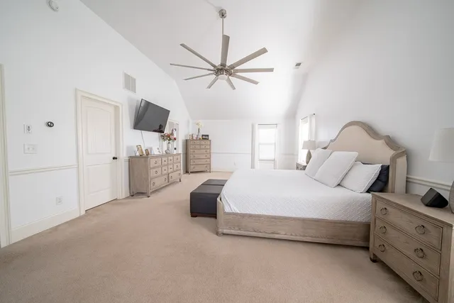 a bedroom with bed and tv