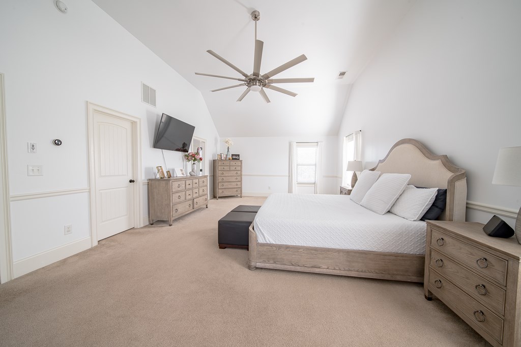 33 Utah Street Fort Mitchell, AL 36856 - Photo 31 of 49 a spacious bedroom with a bed closet and flat screen tv