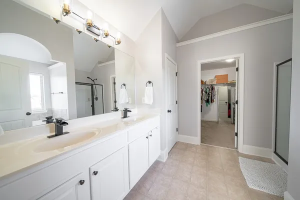 a view of a bathroom with a glass shower door