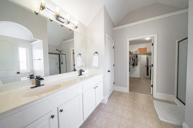 a view of a bathroom with a glass shower door
