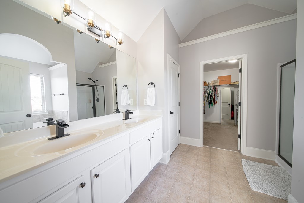 33 Utah Street Fort Mitchell, AL 36856 - Photo 34 of 49 a spacious bathroom with a double vanity sink mirror and shower