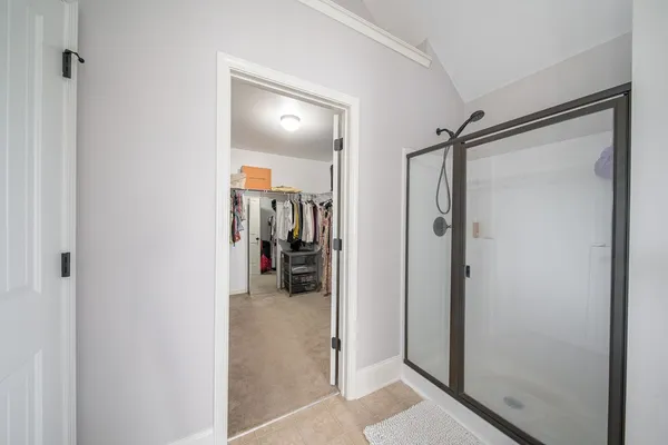 a bathroom with a double vanity sink and mirror