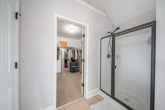 a bathroom with a double vanity sink and mirror