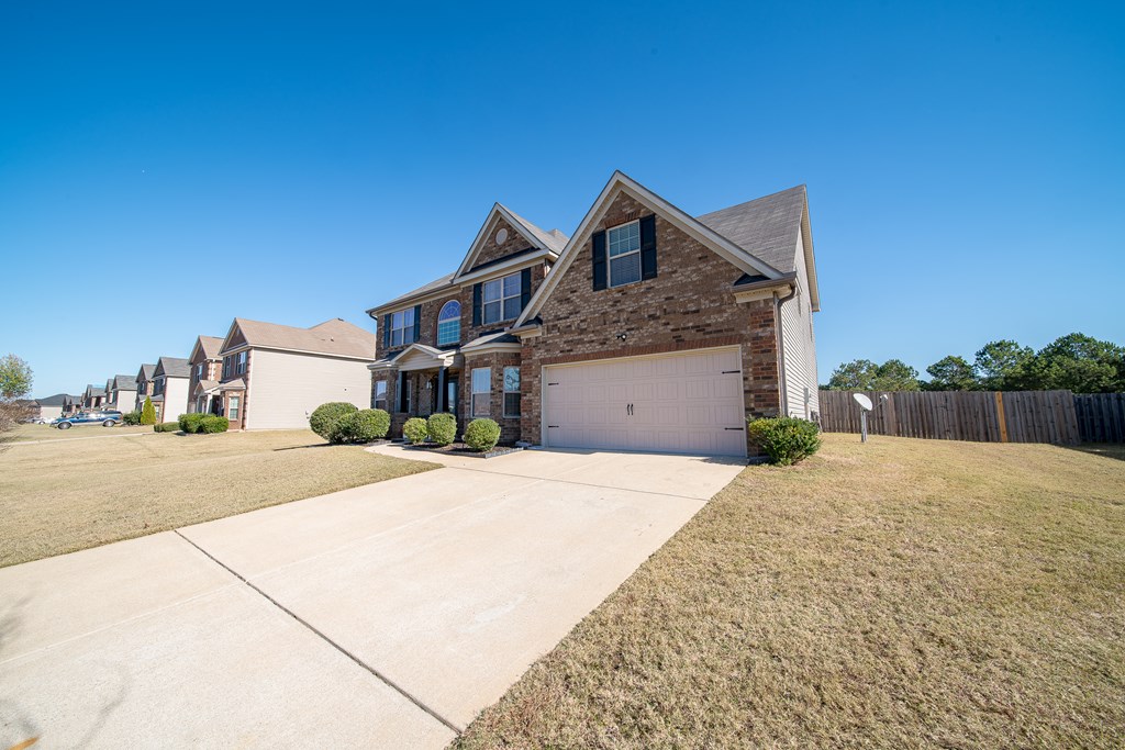 33 Utah Street Fort Mitchell, AL 36856 - Photo 43 of 49 a front view of a house with a yard and garage