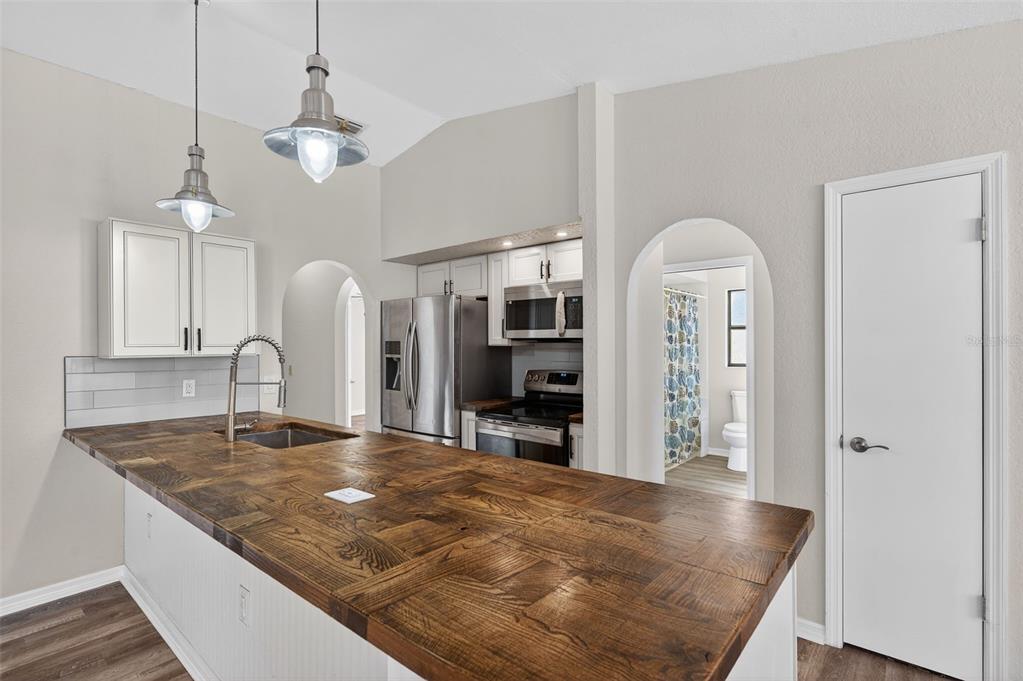 12435 Lola Drive Spring Hill, FL 34608 - Photo 14 of 63 a view of kitchen and kitchen island