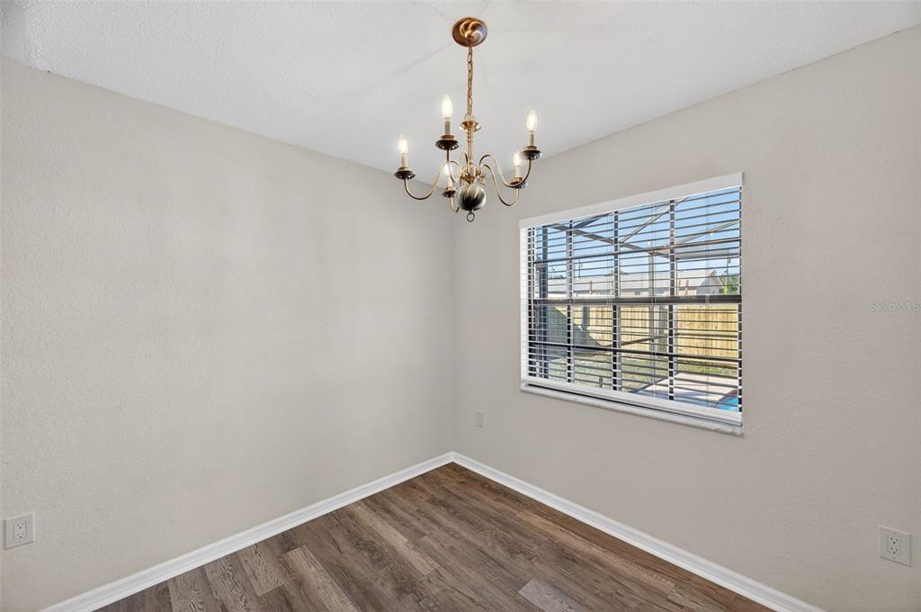 12435 Lola Drive Spring Hill, FL 34608 - Photo 20 of 63 a view of a room with a ceiling fan and a window