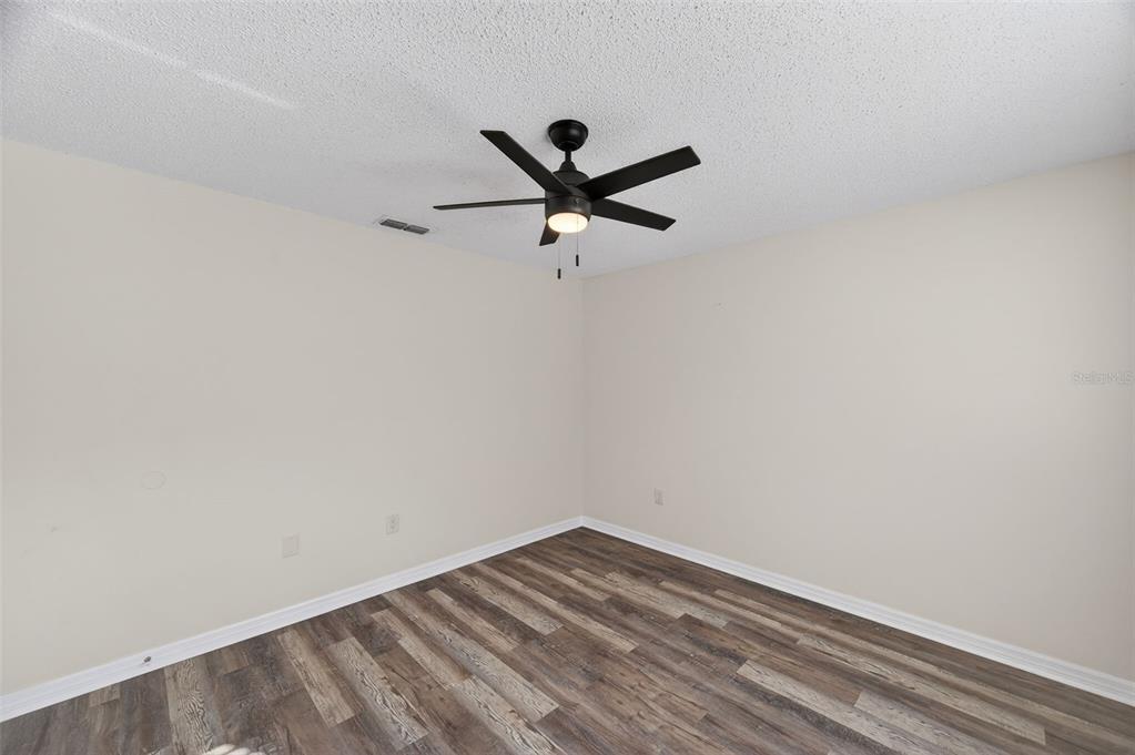 12435 Lola Drive Spring Hill, FL 34608 - Photo 35 of 63 a view of a room with a fan and a ceiling fan