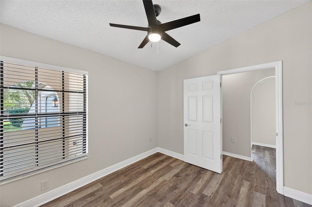 12435 Lola Drive Spring Hill, FL 34608 - Photo 40 of 63 wooden floor in an empty room with a window