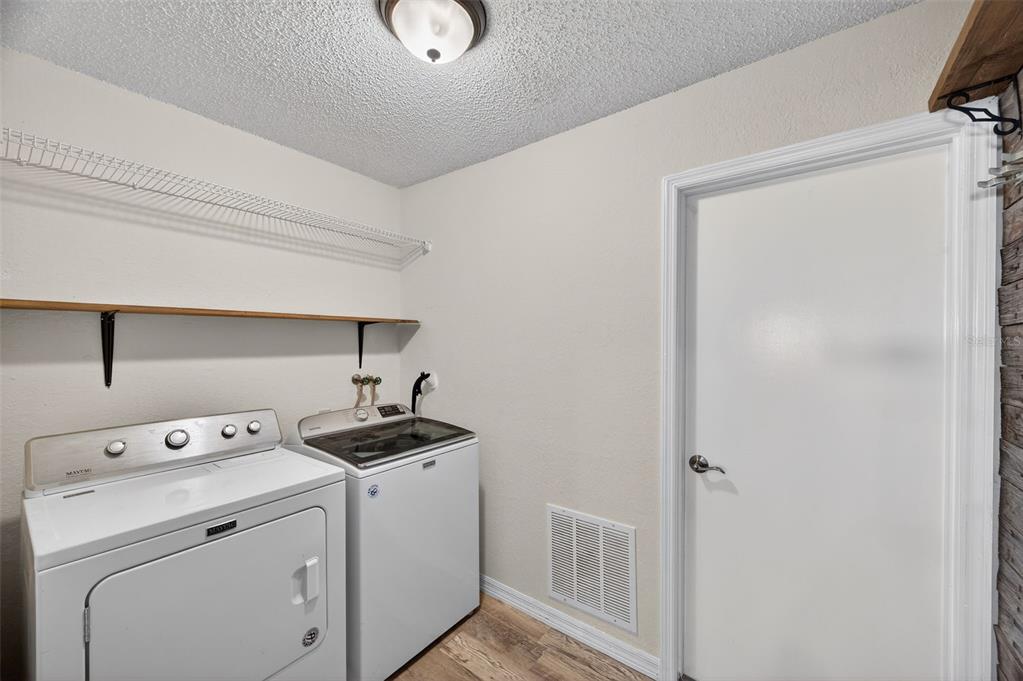 12435 Lola Drive Spring Hill, FL 34608 - Photo 43 of 63 a view of a storage & utility room with a window