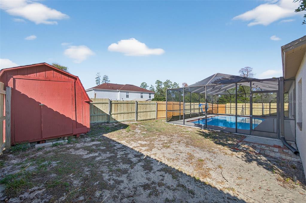 12435 Lola Drive Spring Hill, FL 34608 - Photo 53 of 63 a view of a backyard