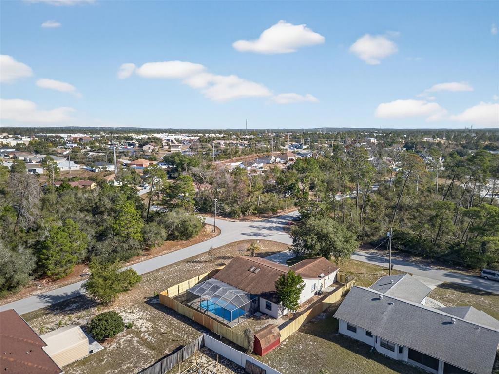 12435 Lola Drive Spring Hill, FL 34608 - Photo 58 of 63 an aerial view of a house with a yard