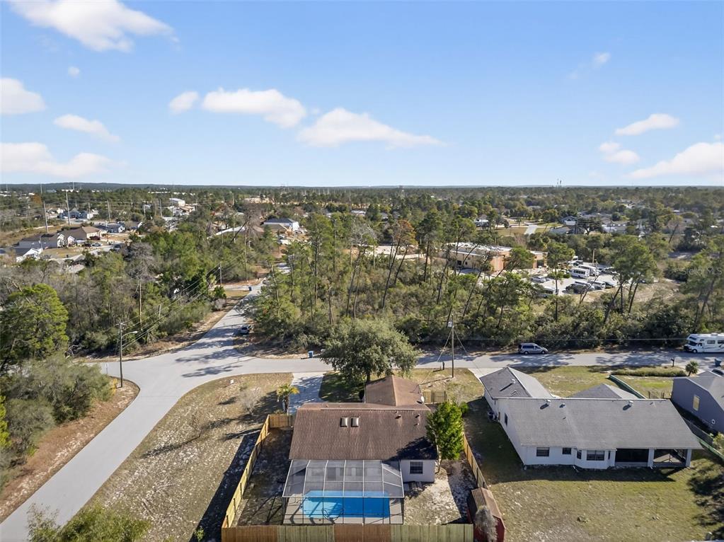 12435 Lola Drive Spring Hill, FL 34608 - Photo 59 of 63 an aerial view of residential houses with outdoor space