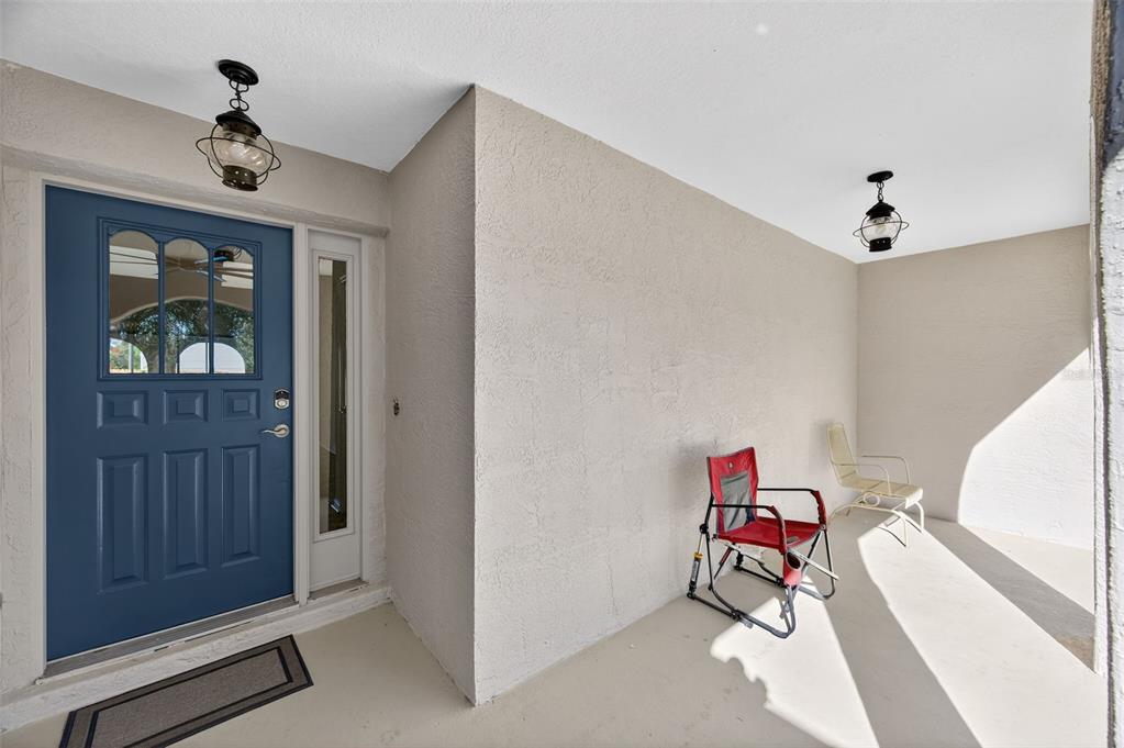 12435 Lola Drive Spring Hill, FL 34608 - Photo 8 of 63 a living room with furniture and paintings on the wall