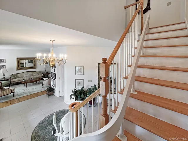 a view of entryway livingroom and hall with wooden floor