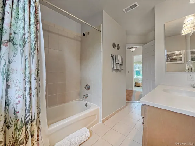 a bathroom with a bathtub and a sink