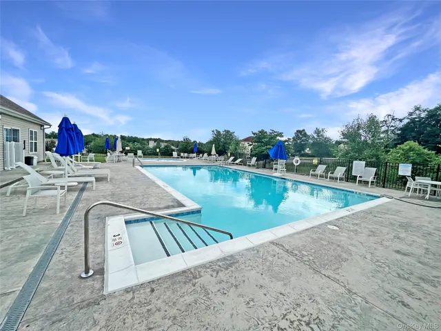 a view of a swimming pool with a lake view