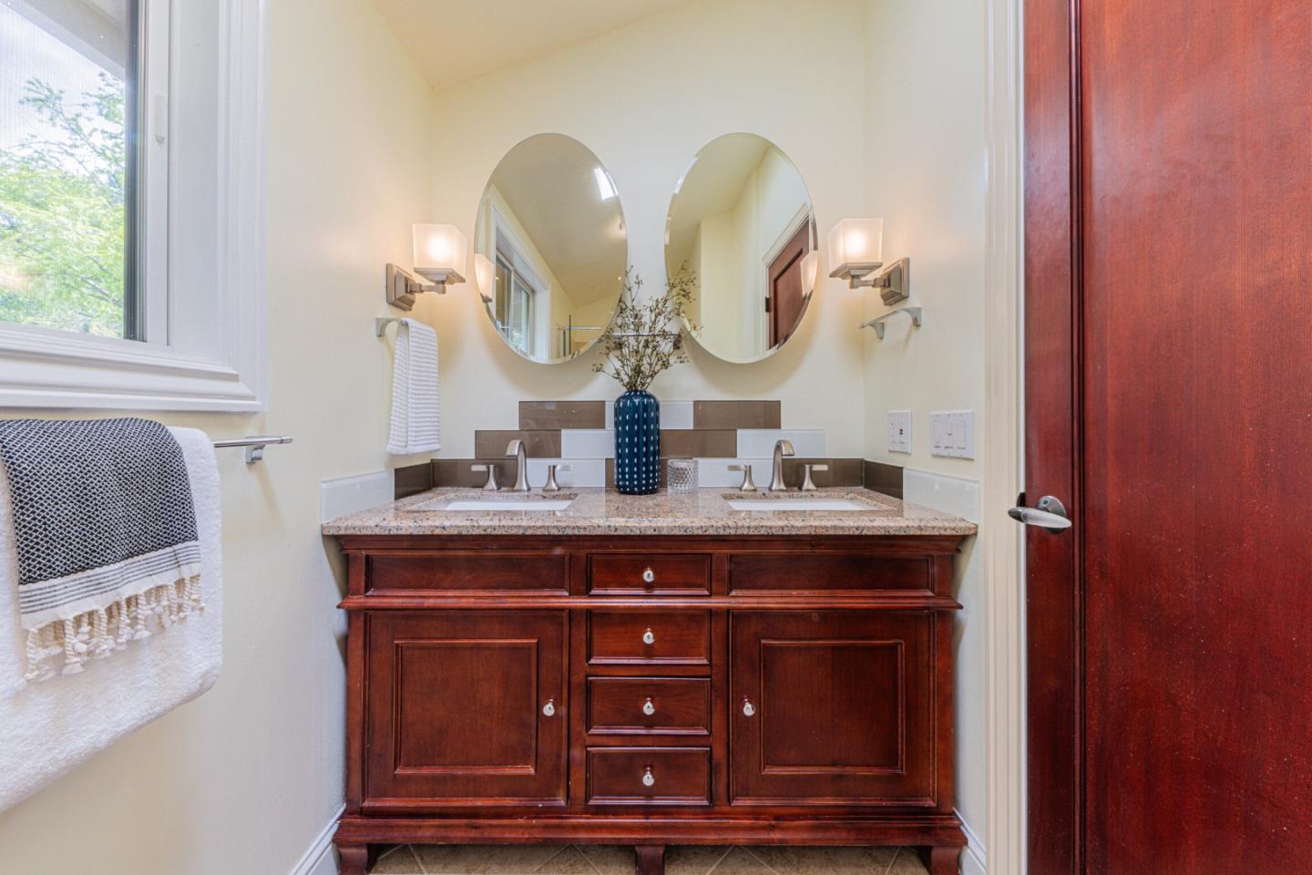 430 Quail Run Road Aptos, CA 95003 - Photo 31 of 34 a bathroom with a sink and a mirror