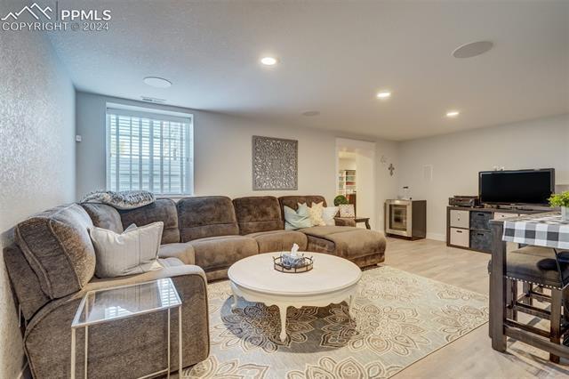 24076 Kobilan Road Calhan, CO 80808 - Photo 27 of 50 Living room with light hardwood / wood-style floors