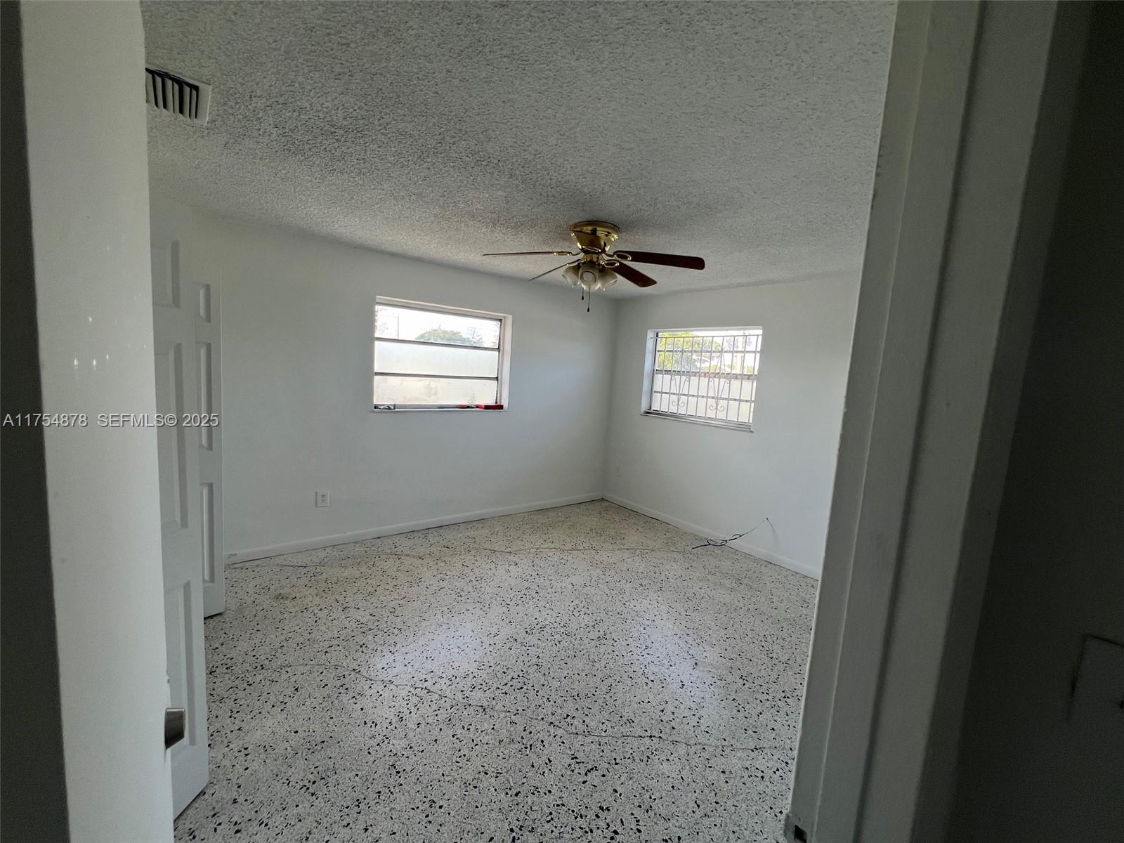 887 West 29th Street, Unit 2 Hialeah, FL 33012 - Photo 3 of 10 a view of an empty room with a window