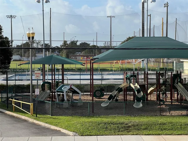 a view of a swimming pool with seating area