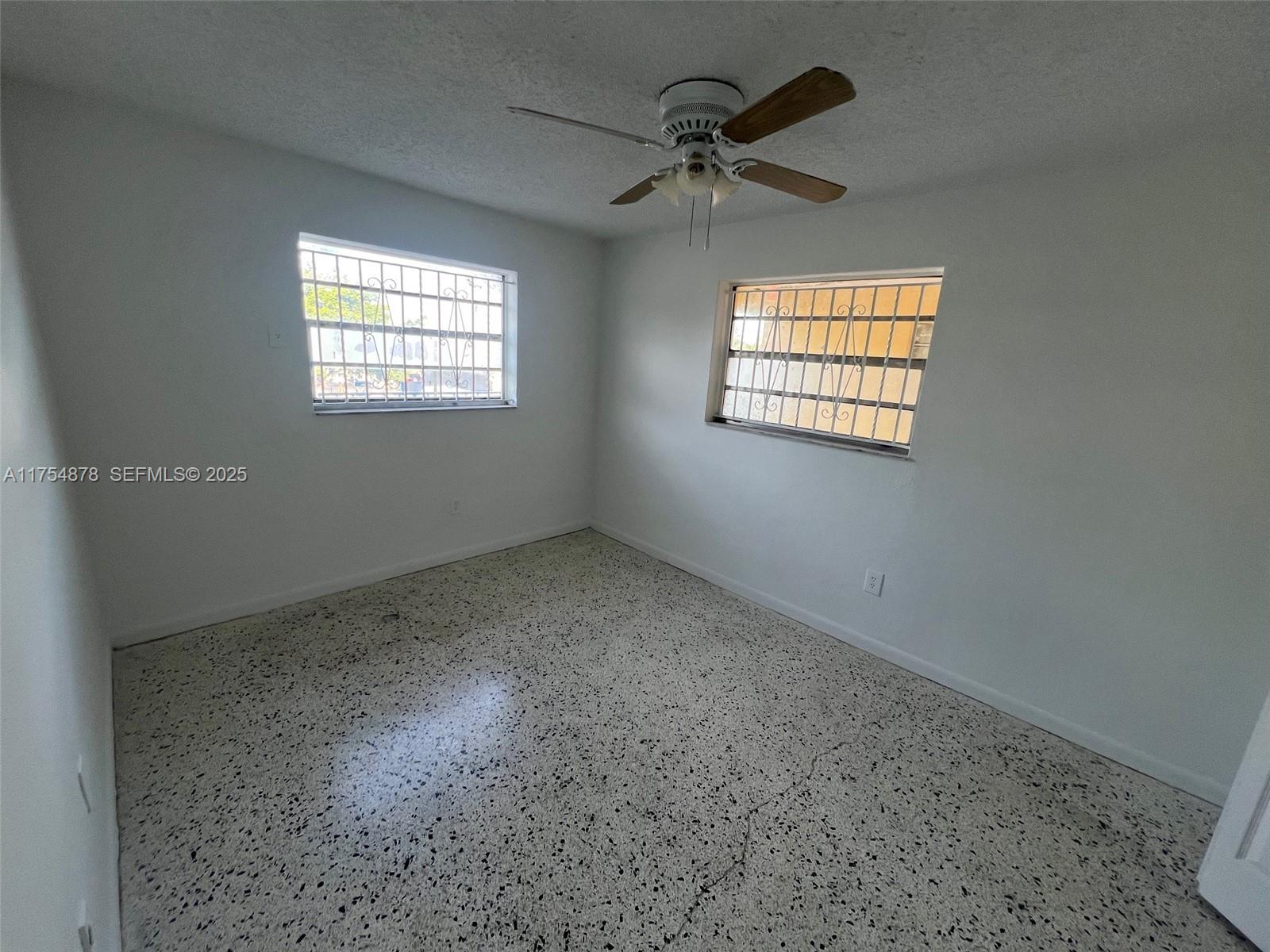 887 West 29th Street, Unit 2 Hialeah, FL 33012 - Photo 6 of 10 a view of an empty room with a window