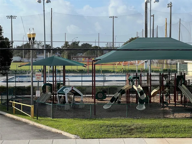 a view of a swimming pool with seating area
