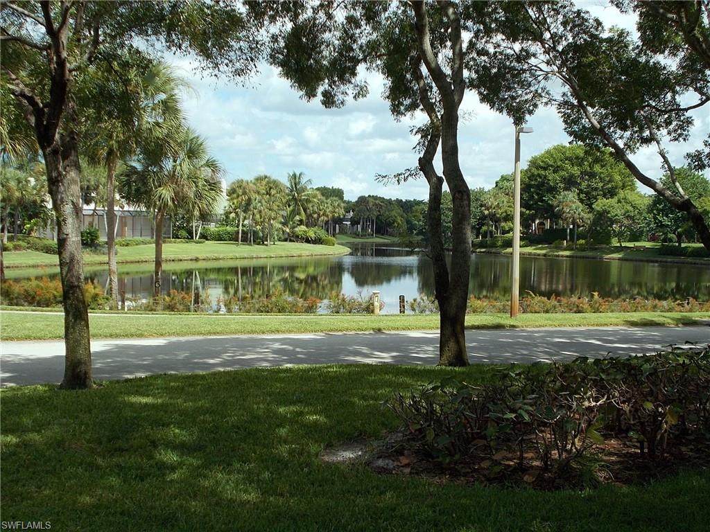 847 Tanbark Drive, Unit 101 Naples, FL 34108 - Photo 10 of 11 a view of a lake view with a big yard