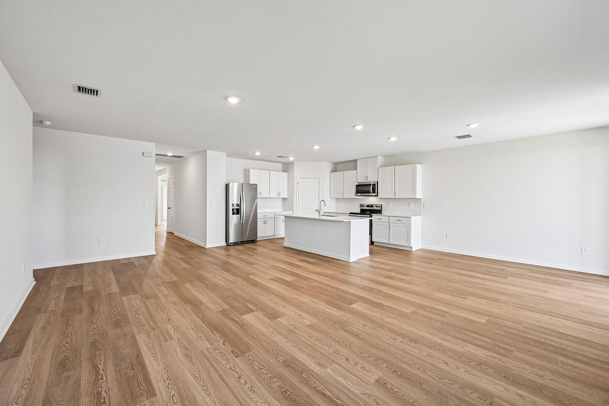 14503 Southwest New Dawn Road Indiantown, FL 34956 - Photo 7 of 42 a view of kitchen with wooden floor