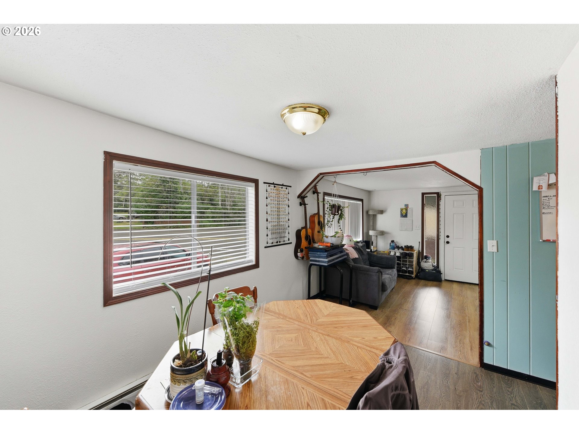 1955 Maple Street North Bend, OR 97459 - Photo 12 of 48 a living room with furniture and a potted plant