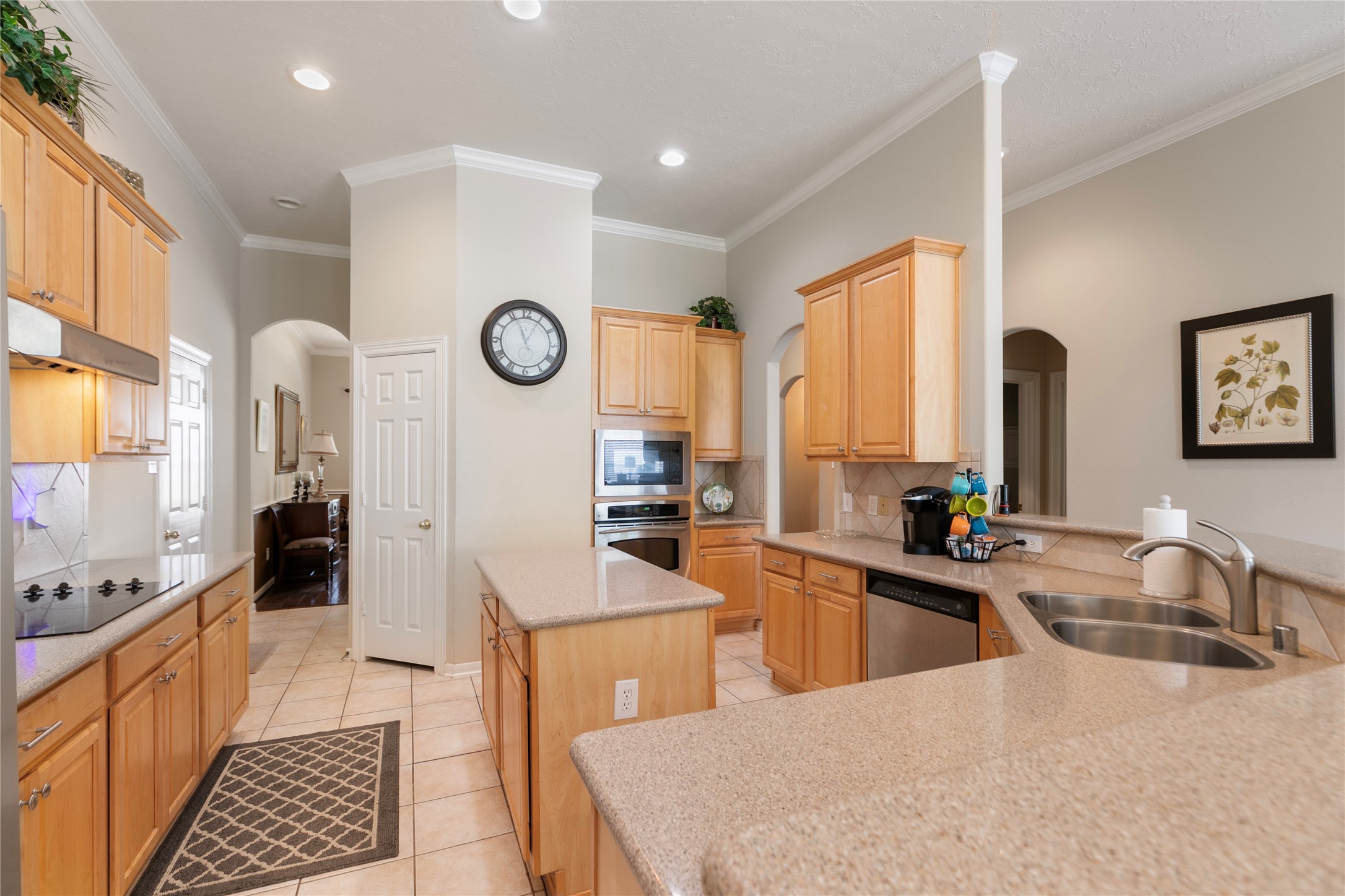 6611 Knollbridge Lane Spring, TX 77379 - Photo 11 of 40 a large kitchen with a large window and stainless steel appliances