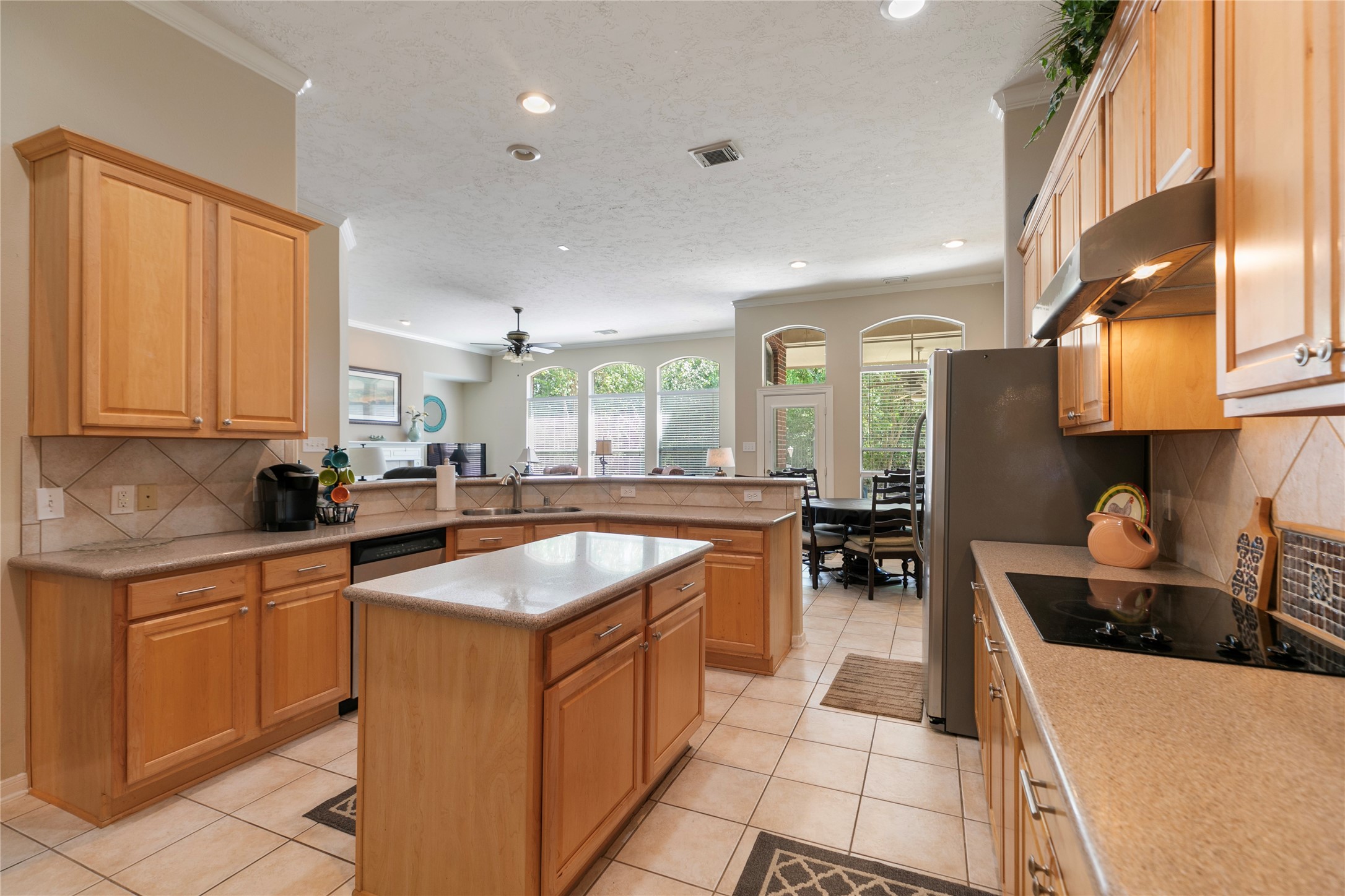 6611 Knollbridge Lane Spring, TX 77379 - Photo 12 of 40 a kitchen with stainless steel appliances a sink stove and cabinets