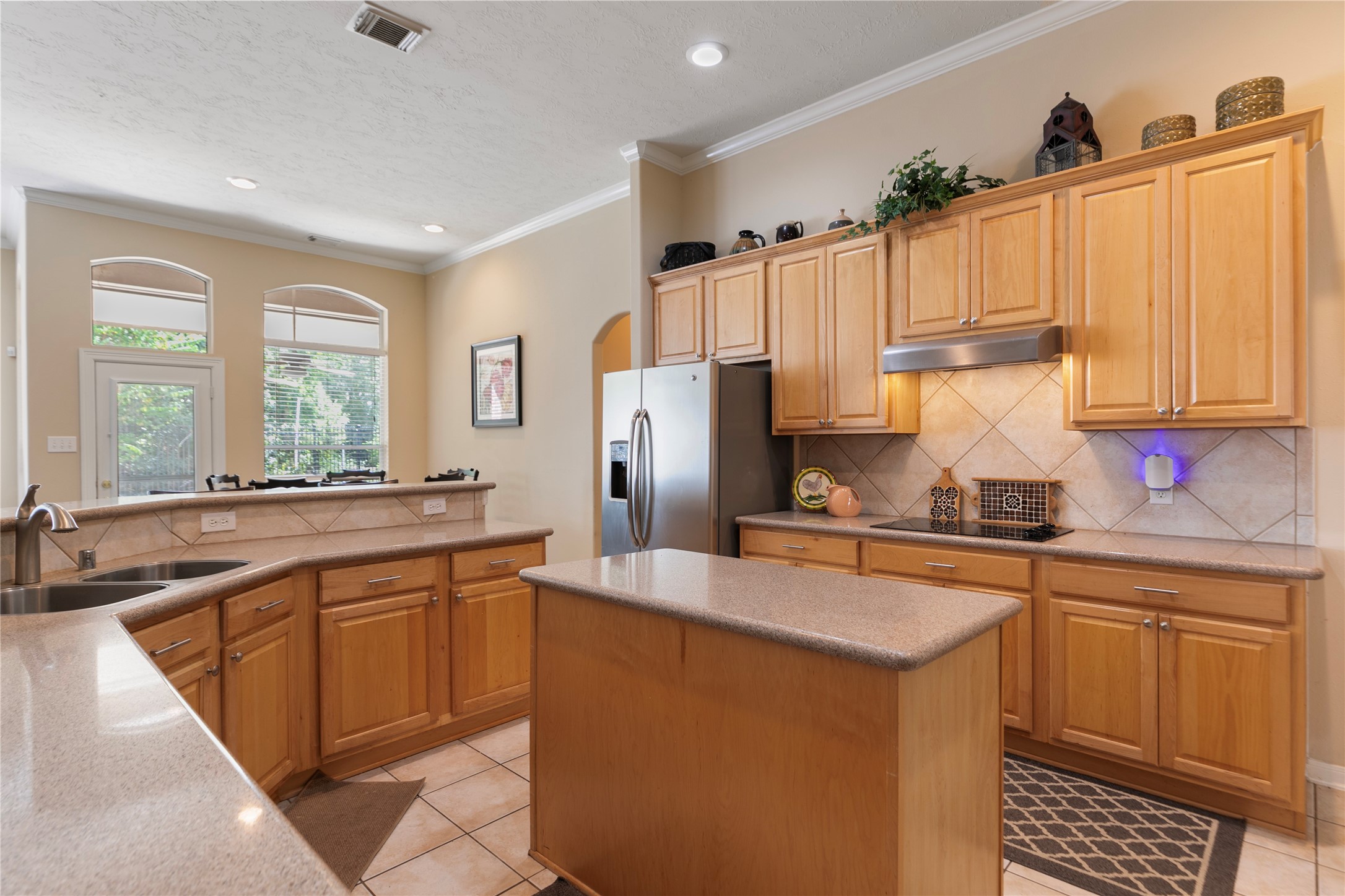 6611 Knollbridge Lane Spring, TX 77379 - Photo 14 of 40 a kitchen with stainless steel appliances a sink stove and refrigerator