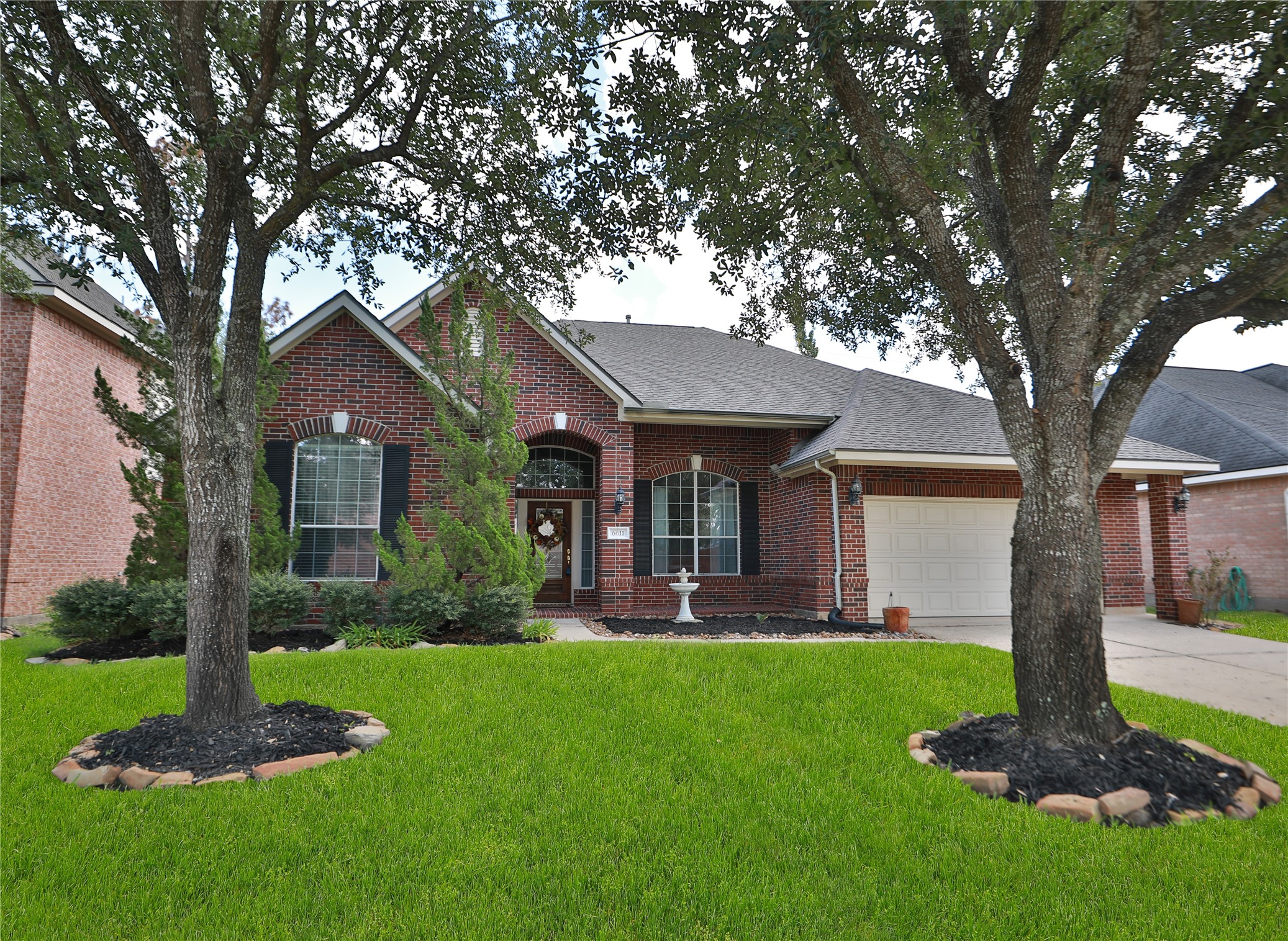 6611 Knollbridge Lane Spring, TX 77379 - Photo 31 of 40 a front view of a house with a yard and tree