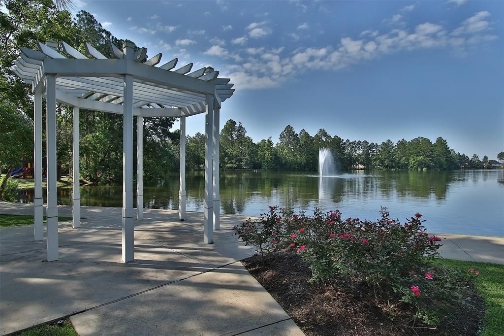 6611 Knollbridge Lane Spring, TX 77379 - Photo 33 of 40 a lake view with a sitting space and garden view