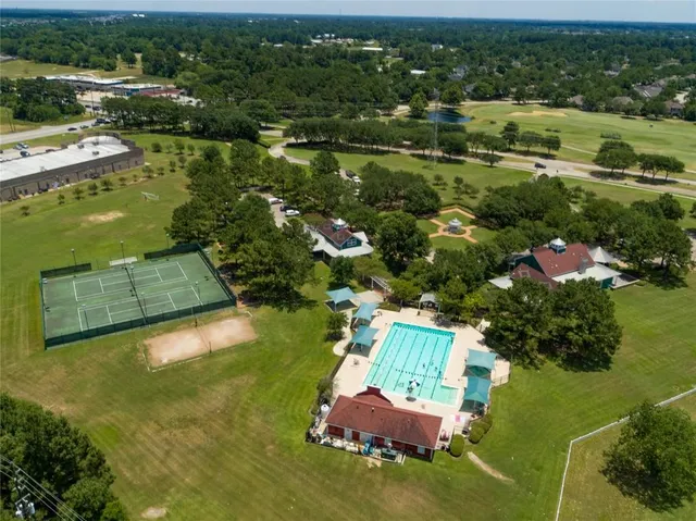 an aerial view of a house with a lake view