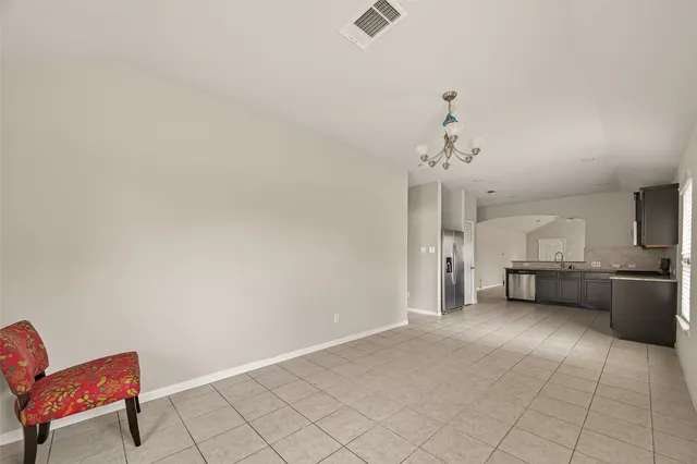 a view of a livingroom with furniture and a ceiling fan