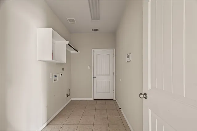 a view of a hallway with closet and entryway