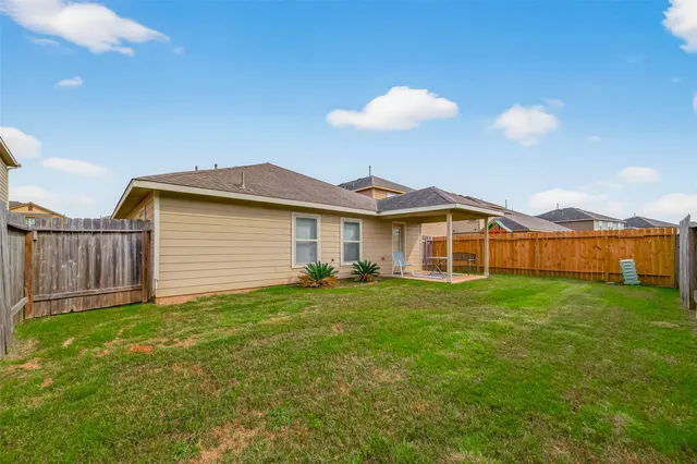 a view of a yard in front of a house with a yard