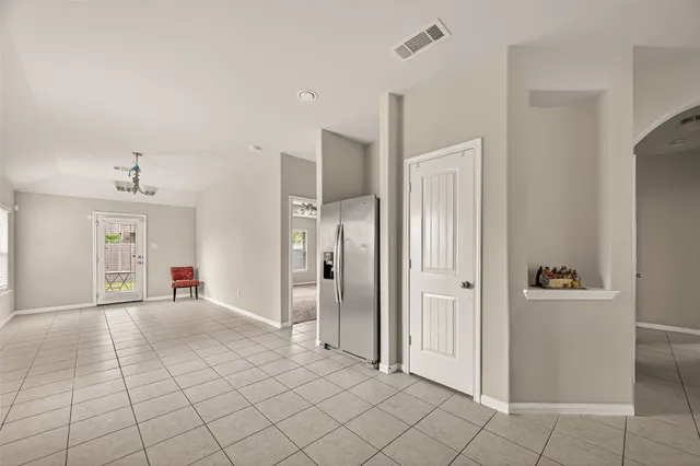 a view of a livingroom with wooden floor and cabinet